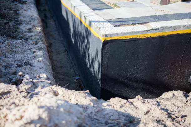Professional Waterproofing technician working in Holt, AL